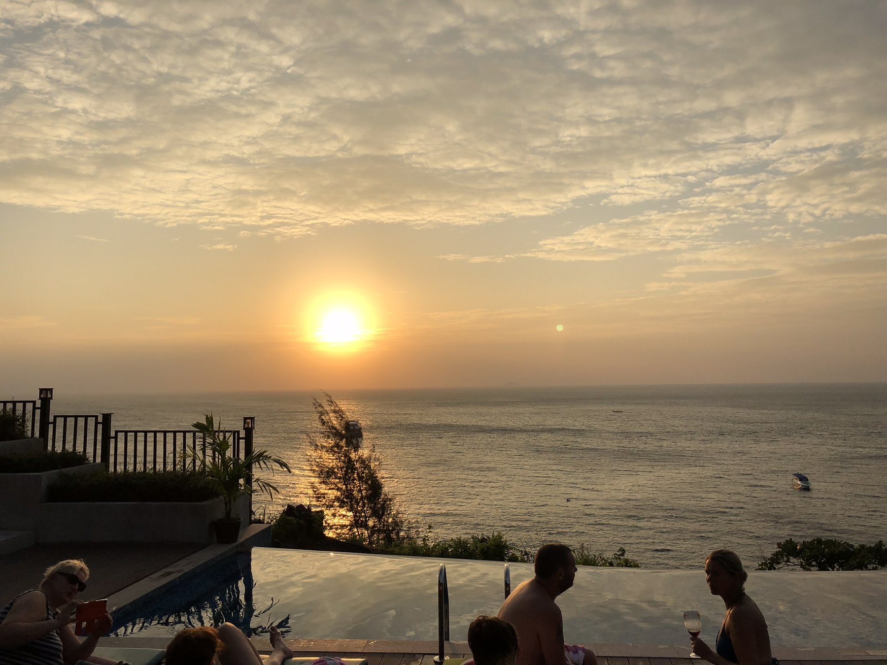 Ko Lanta — Sunset dropping into the Andaman Sea.