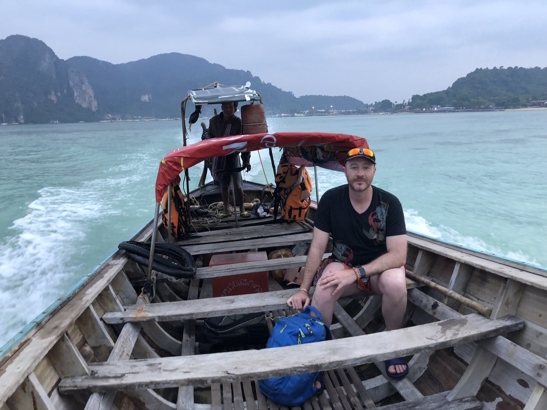 Phi Phi Islands — Riding a long-tail boat between the limestone islands.